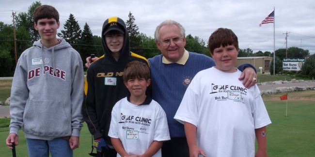 Bob Working With Kids At The Autism Golf Camp